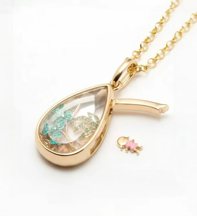 Teardrop locket close up with charms